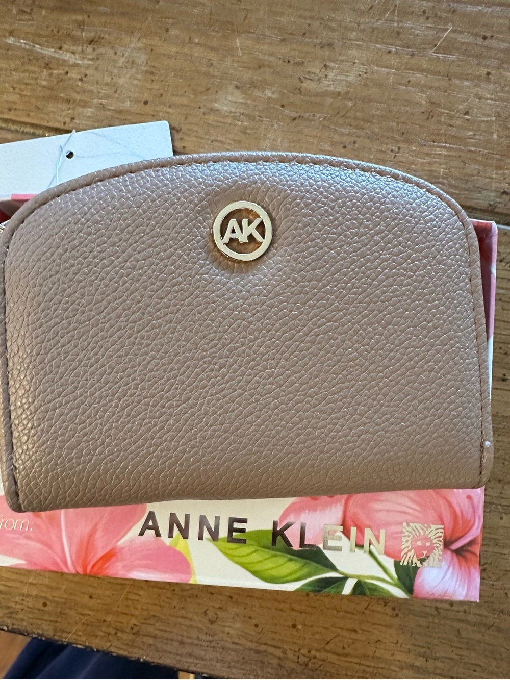 Anne Klein Pebbled Leather curved card case in Taupe with Gold AK Emblem